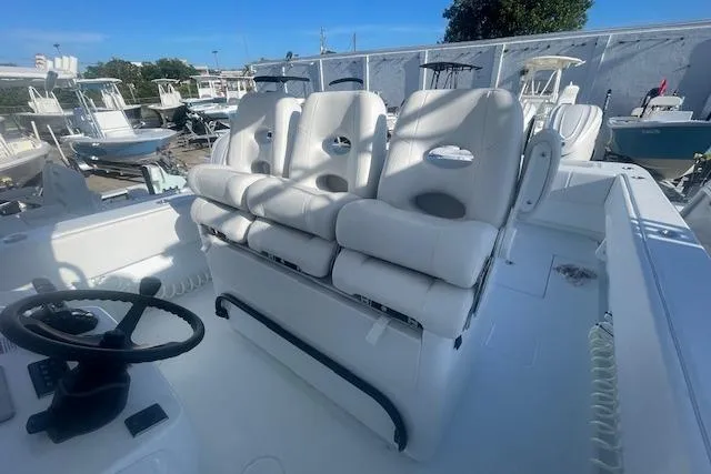 Slide: The Image of 2026 Contender 39 ST boat interior with white seating and steering wheel. - 12