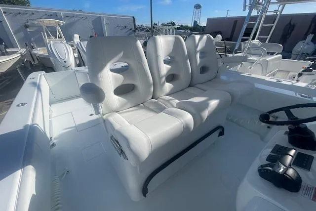 Slide: The Image of 2026 Contender 39 ST boat with white seating and modern helm controls. - 13