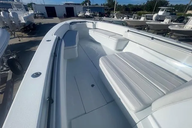 Slide: The Image of 2026 Contender 39 ST boat interior with cushioned seating and spacious deck. - 15
