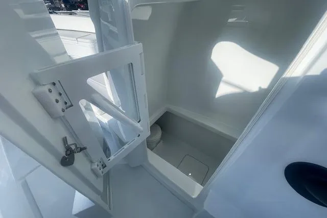 Slide: The Image of Interior view of 2026 Contender 39 ST boat cabin with open door. - 16