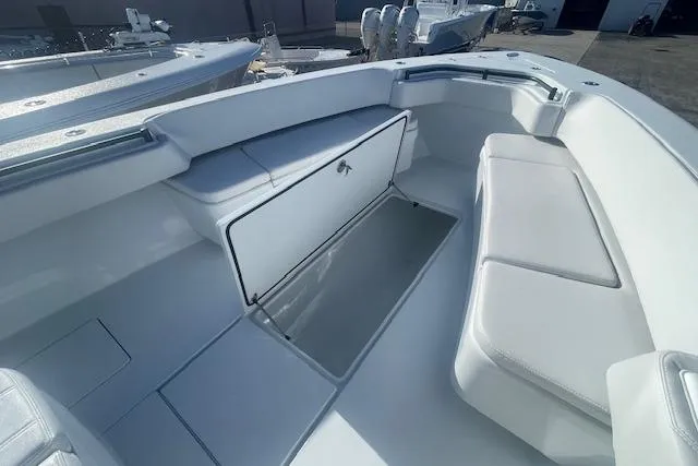 Slide: The Image of 2026 Contender 39 ST boat interior with open storage compartment and seating. - 19