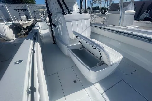 Slide: The Image of 2026 Contender 39 ST boat interior with open storage compartment, showcasing sleek design. - 20