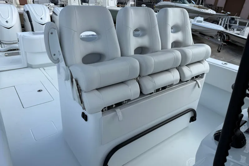 Slide: The Image of 2026 Contender 39 ST boat with three white cushioned seats on deck. - 24