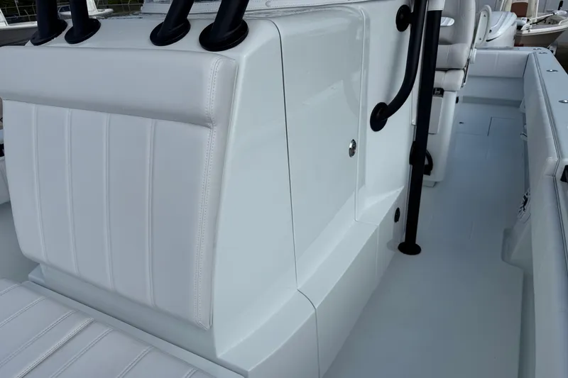 Slide: The Image of 2026 Contender 39 ST boat interior with white seating and black handles. - 26
