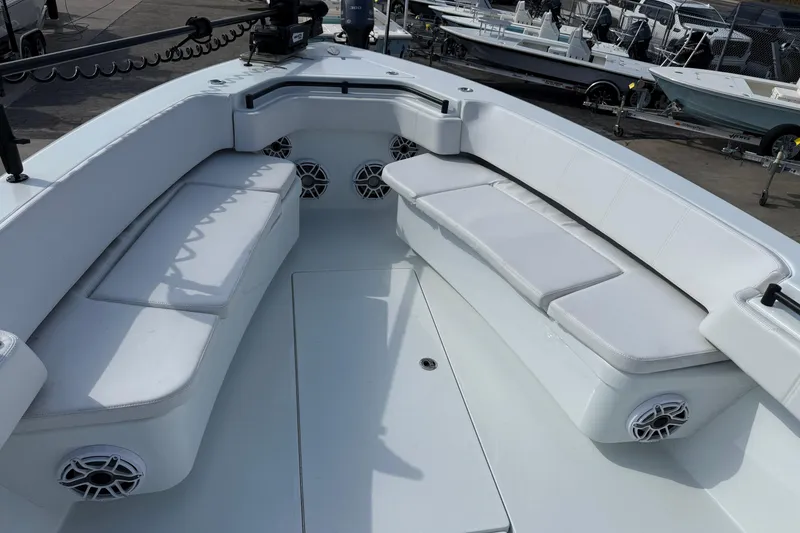 Slide: The Image of 2026 Contender 39 ST boat interior with cushioned seating and speakers. - 27