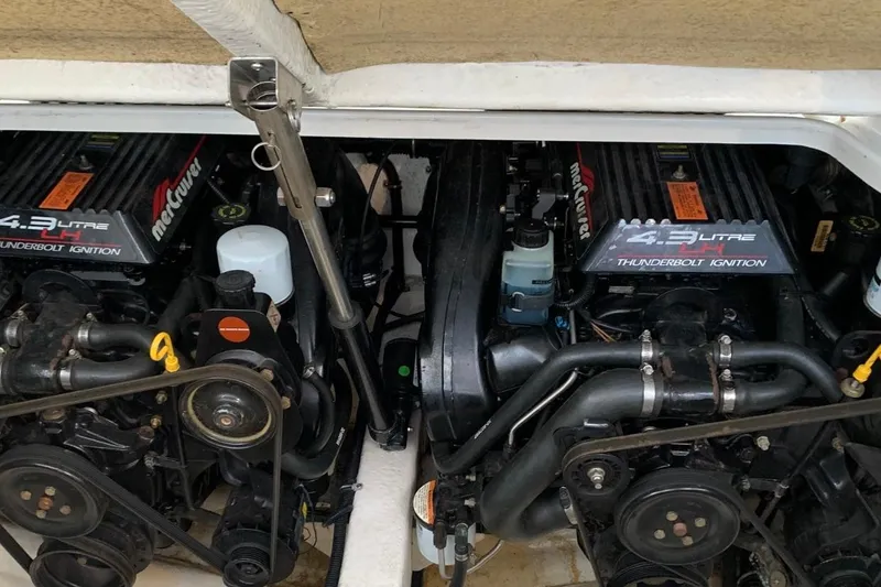 Slide: The Image of Twin MerCruiser engines in a 1998 Formula 27 Performance Cruiser boat. - 8