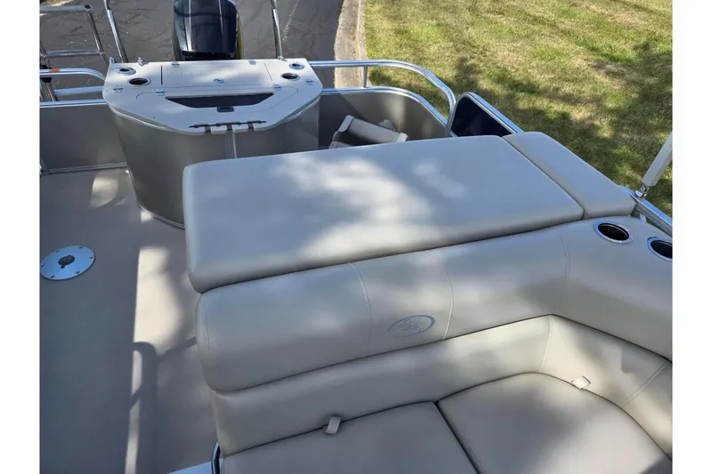 Slide: The Image of 2014 South Bay 522 FCR boat interior with beige seating and cup holders. - 14