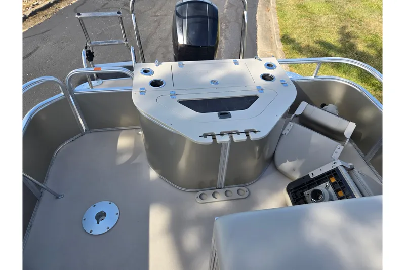 Slide: The Image of 2014 South Bay 522 FCR pontoon boat interior with seating and storage compartments. - 16