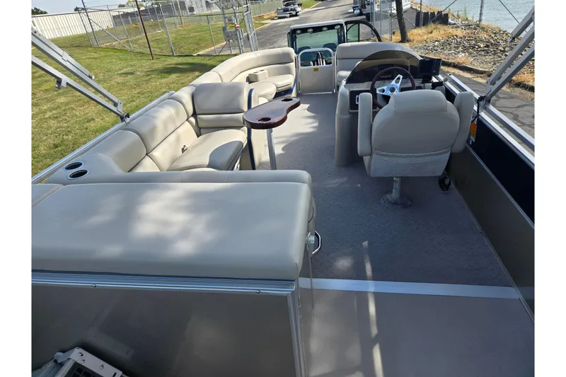 Slide: The Image of 2014 South Bay 522 FCR pontoon boat interior with seating and steering console. - 20