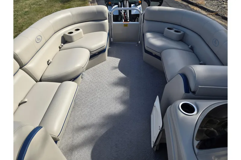 Slide: The Image of 2014 South Bay 522 FCR pontoon boat interior with beige seating and cup holders. - 24