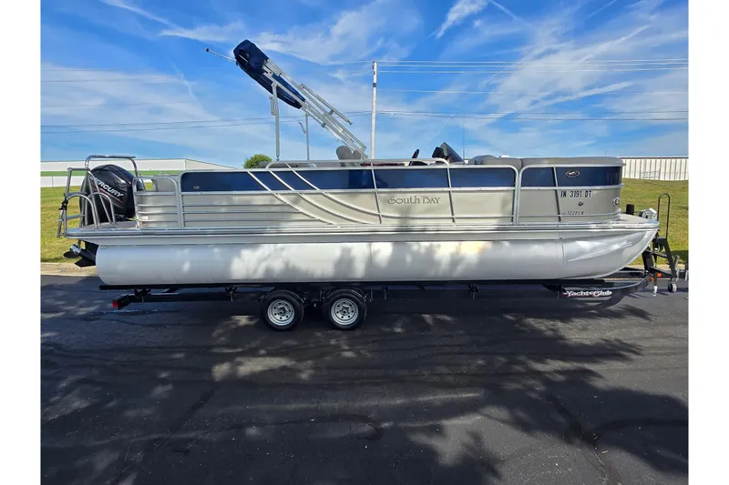 Slide: The Image of 2014 South Bay 522 FCR pontoon boat on trailer, parked outdoors under blue sky. - 4