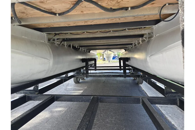 Slide: The Image of Underneath view of a 2014 South Bay 522 FCR pontoon boat on a trailer. - 7