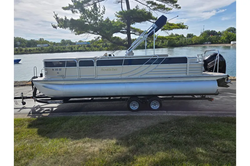 Slide: The Image of 2014 South Bay 522 FCR pontoon boat on trailer by a scenic river. - 9