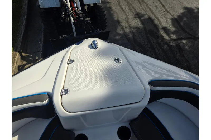 Slide: The Image of 2020 Yamaha Boats AR210 bow area with seating and storage compartment. - 21