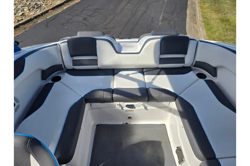 Slide: The Image of 2020 Yamaha Boats AR210 interior seating with black and white upholstery. - 25