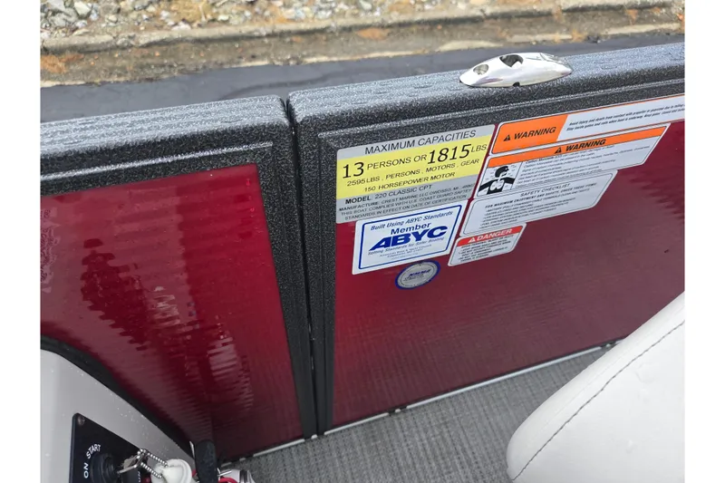 Slide: The Image of 2022 Crest Classic LX 220 boat capacity and safety warning labels. - 14