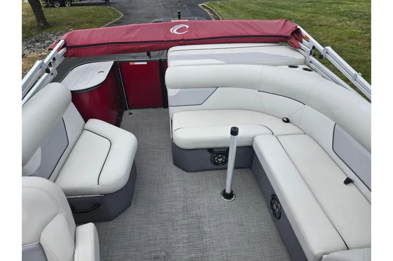Slide: The Image of 2022 Crest Classic LX 220 pontoon boat interior with white seating and red accents. - 15