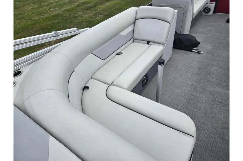 Slide: The Image of 2022 Crest Classic LX 220 boat interior with gray seating and carpeted floor. - 19