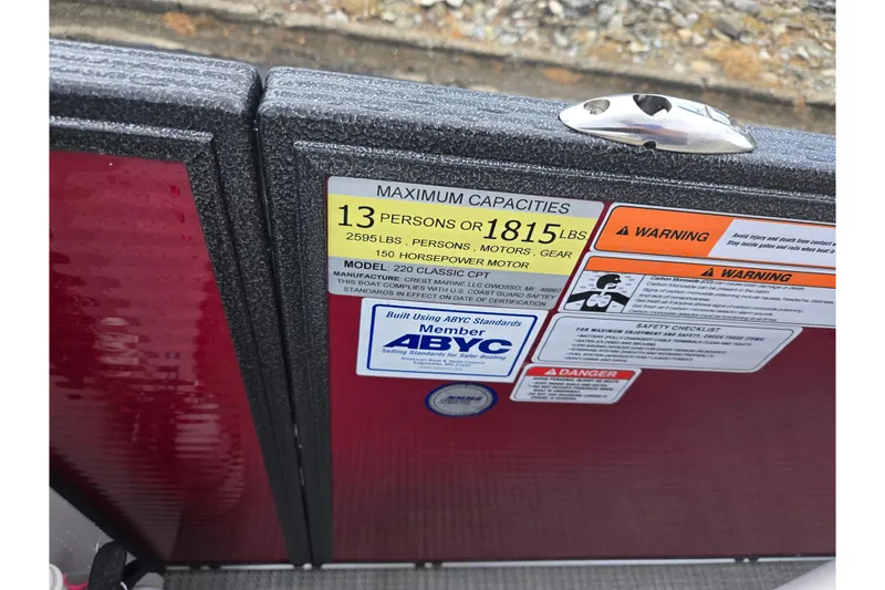 Slide: The Image of Capacity and warning labels on 2022 Crest Classic LX 220 boat. - 22