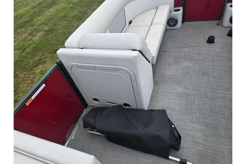 Slide: The Image of 2022 Crest Classic LX 220 interior with white seating and gray flooring. - 23