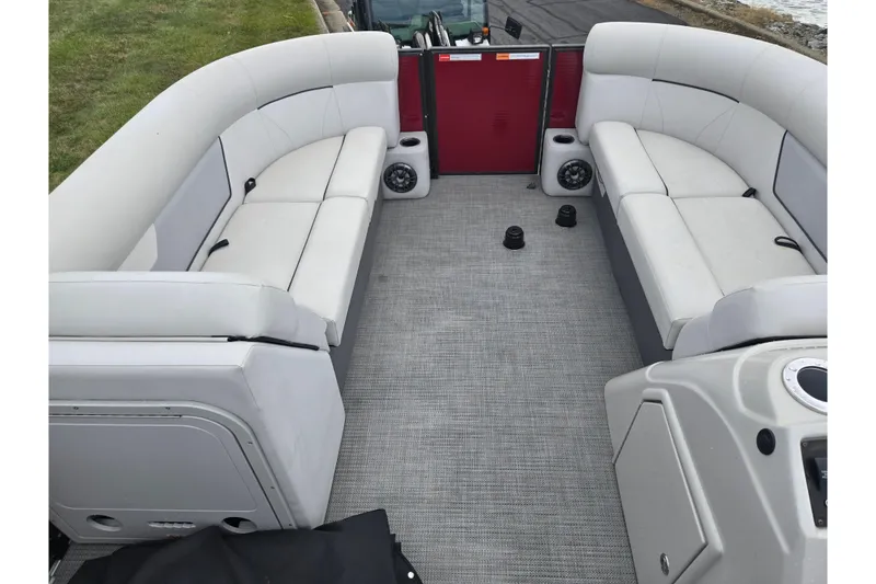 Slide: The Image of Interior of 2022 Crest Classic LX 220 pontoon boat with spacious seating and modern design. - 24