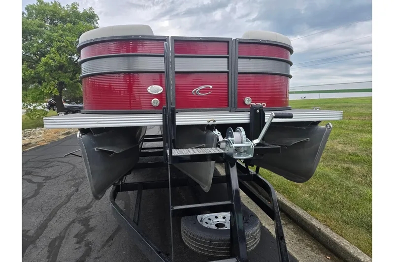 Slide: The Image of 2022 Crest Classic LX 220 pontoon boat on trailer, rear view. - 6