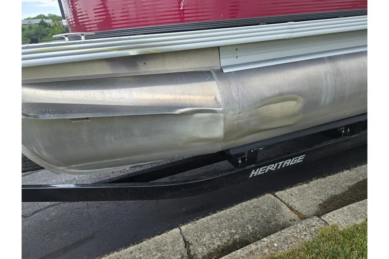 Slide: The Image of 2022 Crest Classic LX 220 pontoon boat with visible dent on the side. - 9