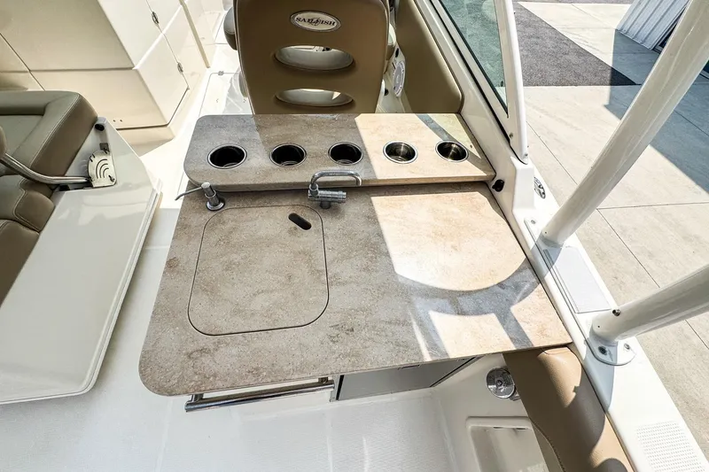 Slide: The Image of 2018 Sailfish 275 DC boat interior with sink and cup holders on deck. - 5
