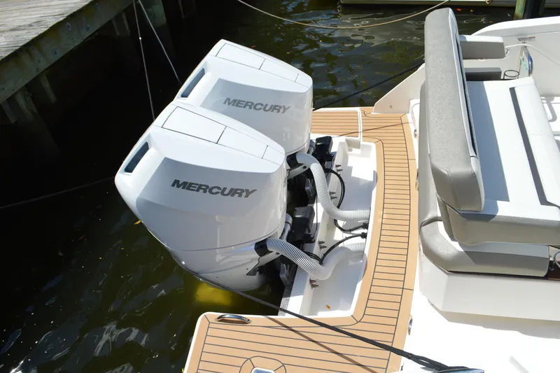 Slide: The Image of 2024 Tiara Yachts 34 LS with dual Mercury outboard engines, docked. - 12