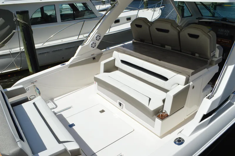 Slide: The Image of 2024 Tiara Yachts 34 LS interior with luxurious seating and modern design. - 13