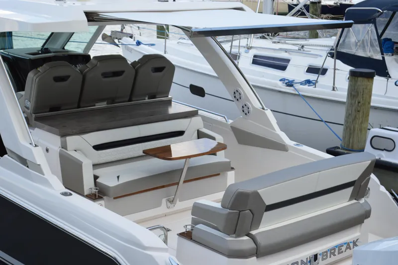 Slide: The Image of 2024 Tiara Yachts 34 LS luxury boat interior with seating and table. - 16