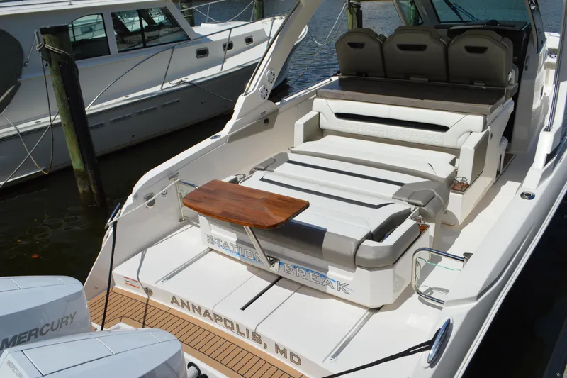 Slide: The Image of 2024 Tiara Yachts 34 LS with seating area, docked in Annapolis, MD. - 19