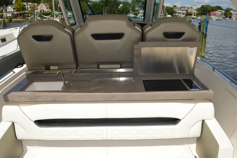 Slide: The Image of 2024 Tiara Yachts 34 LS boat interior with sink and grill station. - 20