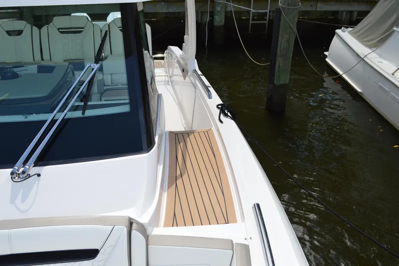 Slide: The Image of 2024 Tiara Yachts 34 LS boat with sleek deck design and modern features. - 23