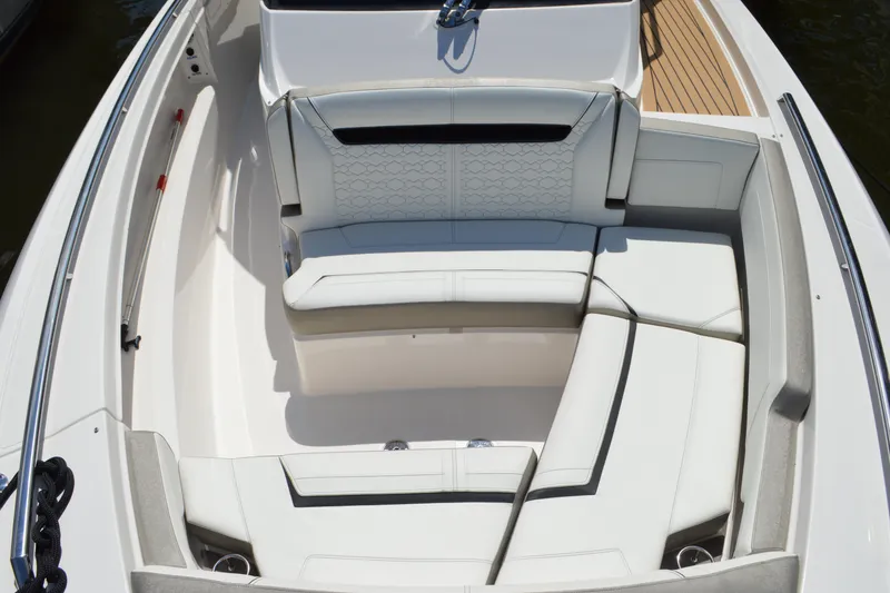 Slide: The Image of 2024 Tiara Yachts 34 LS boat interior with luxurious white seating arrangement. - 24