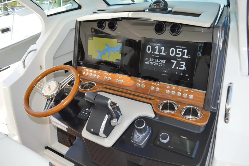 Slide: The Image of 2024 Tiara Yachts 34 LS helm with advanced navigation displays and controls. - 29