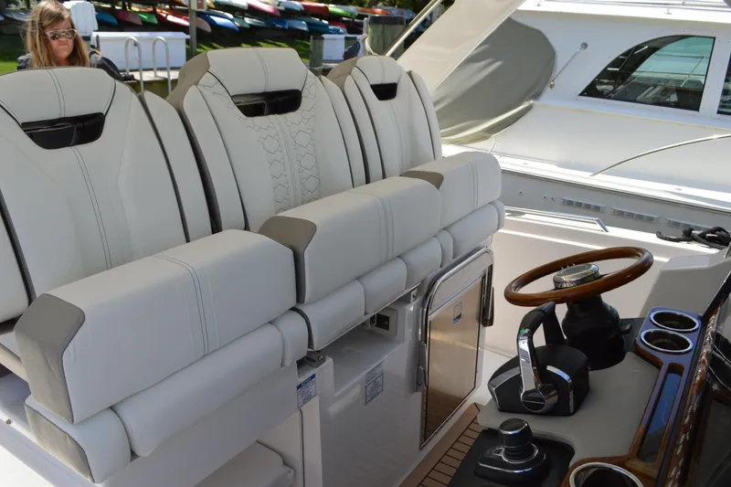Slide: The Image of 2024 Tiara Yachts 34 LS interior with luxurious seating and modern helm controls. - 30