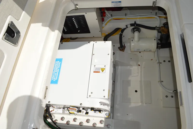 Slide: The Image of 2024 Tiara Yachts 34 LS engine compartment showcasing electrical and mechanical components. - 36