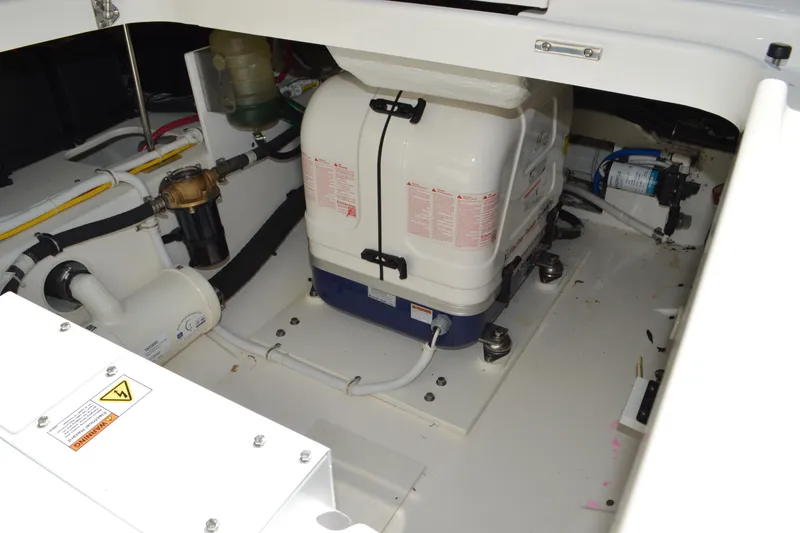 Slide: The Image of Engine compartment of 2024 Tiara Yachts 34 LS, showcasing mechanical components and systems. - 37