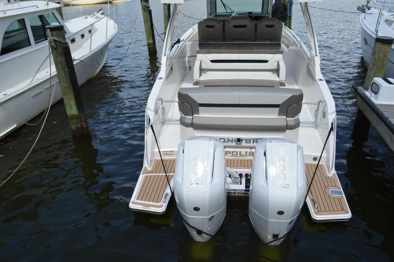 Slide: The Image of 2024 Tiara Yachts 34 LS with dual engines docked at marina. - 8