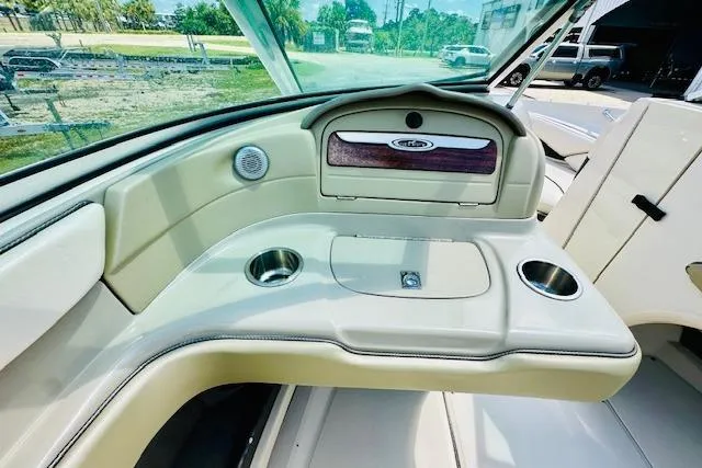 Slide: The Image of 2005 Sea Ray 200 Select boat dashboard with steering wheel and instrument panel. - 14