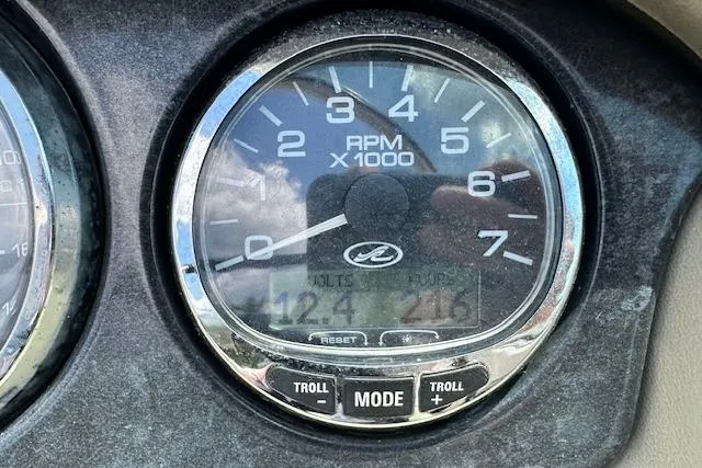 Slide: The Image of Engine compartment of a 2005 Sea Ray 200 Select boat, featuring a 5.0 MerCruiser engine. - 16