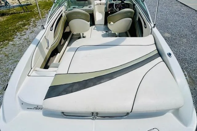 Slide: The Image of 2005 Sea Ray 200 Select boat on trailer, parked outdoors under a blue sky. - 6