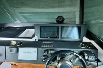 Slide: The Image of 2018 Axopar 37 XC CROSS CABIN helm with dual displays and steering wheel. - 20