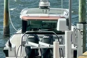 Slide: The Image of 2018 Axopar 37 XC CROSS CABIN boat docked with dual engines. - 7