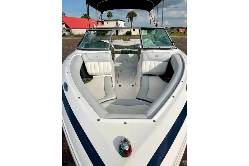 Slide: The Image of 2012 Regal 2100 boat with white interior and open bow seating. - 7