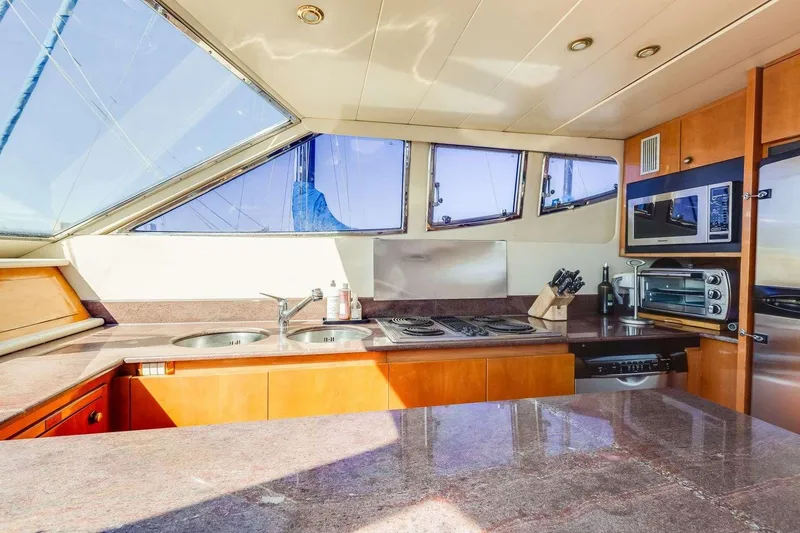 Slide: The Image of Luxurious kitchen interior of a 1988 Azimut Motor Yacht with modern appliances. - 11
