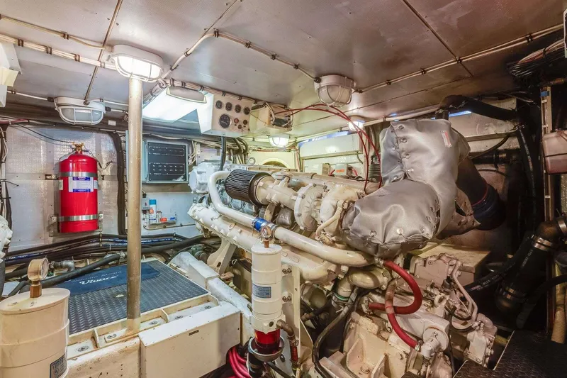 Slide: The Image of Engine room of a 1988 Azimut Motor Yacht, featuring machinery and equipment. - 15