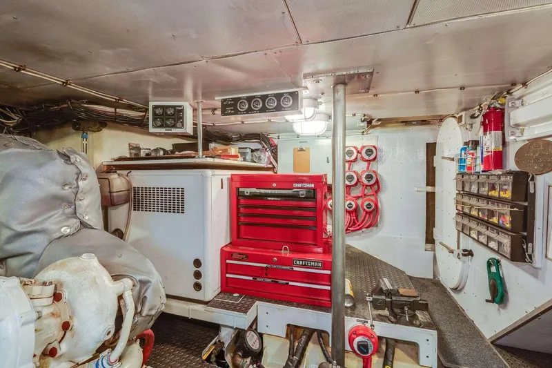 Slide: The Image of Engine room of a 1988 Azimut Motor Yacht with tools and equipment. - 17