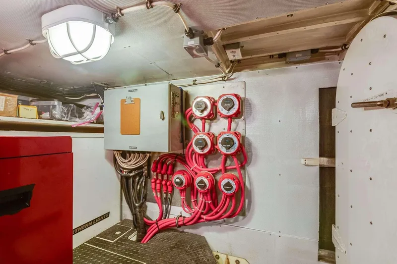Slide: The Image of Engine room of 1988 Azimut Motor Yacht with electrical panels and wiring. - 18